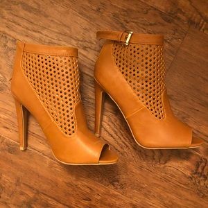 Brown heels with little holes and buckle